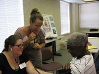 Tammy Fernandez, far left, and Debra Flynn taking a patient's blood pressure at City on a Hill in Milwaukee, WI