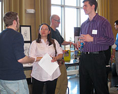 Design student speaking with employers