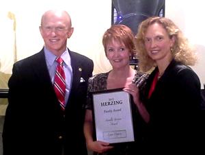 Lynn DuPree awarded by Henry and Renee Herzing