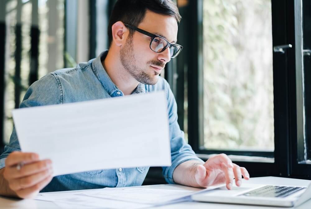 Bookkeeper Working at Laptop