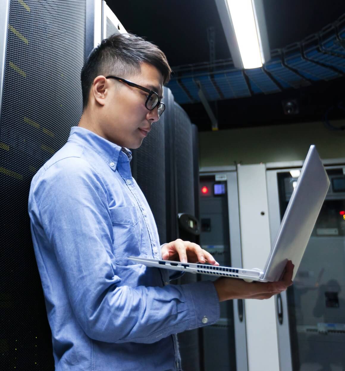 IT Tech on Laptop in Data Center IT Tech on Laptop in Data Center