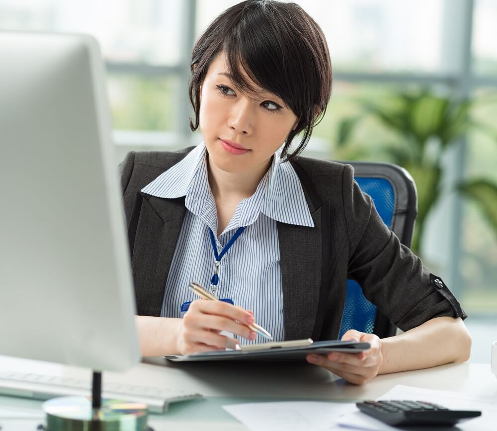 Accountant Working on Report at Computer