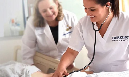 Nurse Instructor Teaching Student to Use Stethoscope