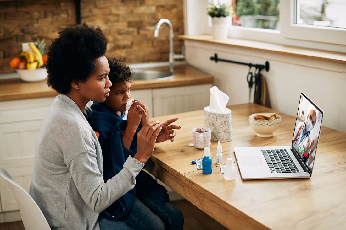 Doctor Conducting Telehealth Appointment with Patients