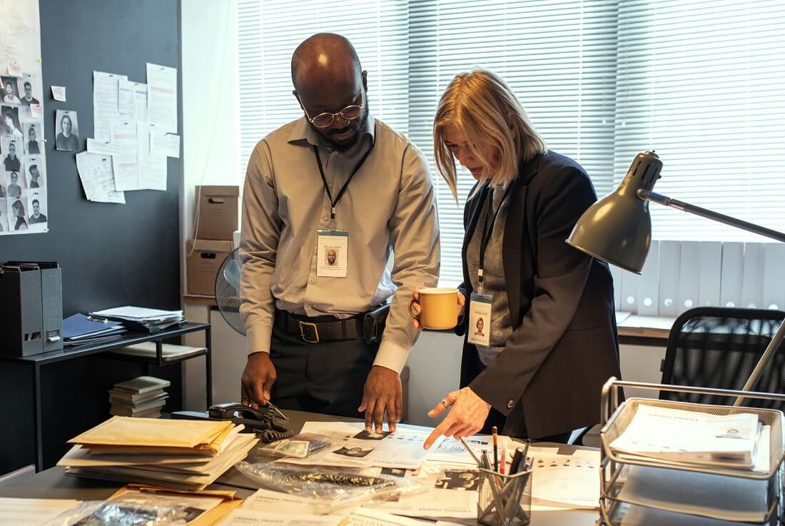 Two detectives trying to clear a case.