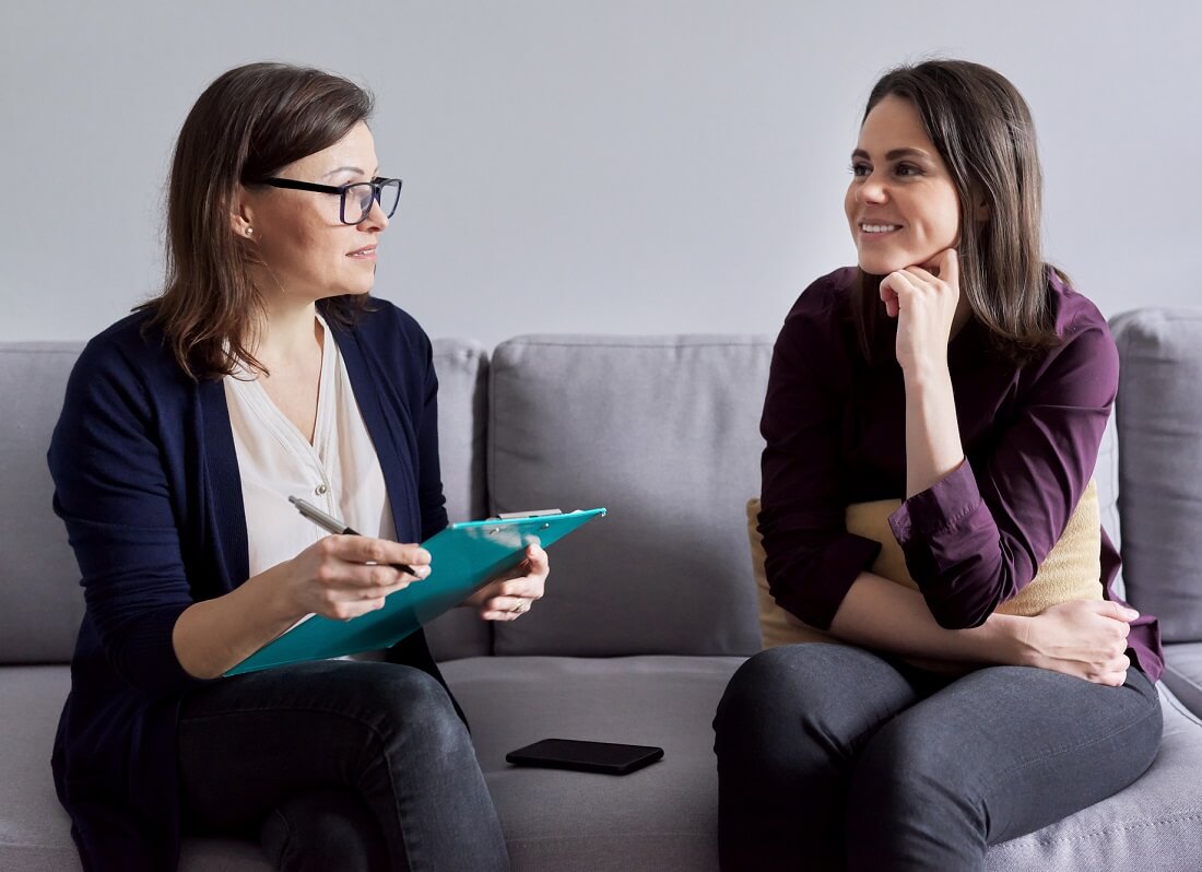 Social Worker Speaking with Client in Office