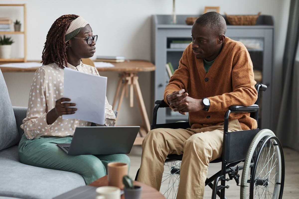 Human Services Worker Discussing Social Services with Client