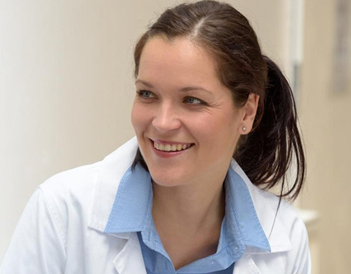 Public Health Nurse Smiling with Patient in Consultation