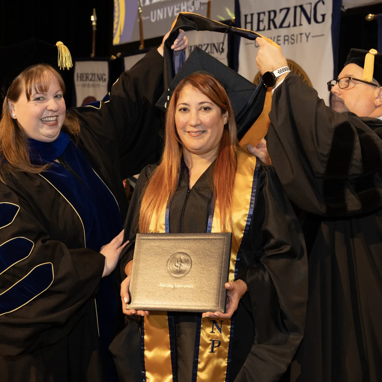 MSN graduate receiving her hood