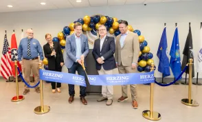 Erik Parks and other Herzing staff cutting a blue ribbon at Herzing Clarksville Grand Opening