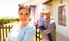 attractive young woman in front of her military family