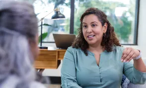 Doctor of Behavioral Health clinician conducting a counseling session with a patient