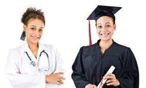 A nursing student smiles while holding her degree in her hand after graduating. 
