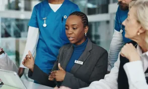 Doctors, nurses or meeting with tablet in hospital for surgery schedule, task delegation or planning. Medical staff, people and feedback with tech for clinic management, healthcare cost and teamwork