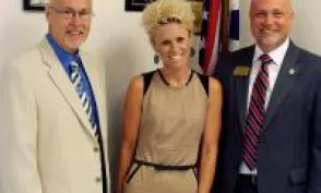 Herzing academic and business leaders smiling for photo