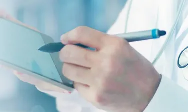 Medical Office Administrator Taking Notes on Clipboard