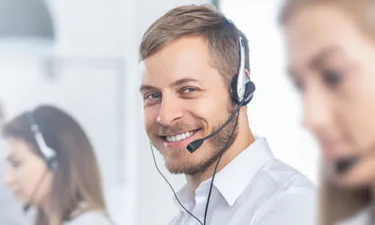 IT Associate Speaking on Headset with Customer