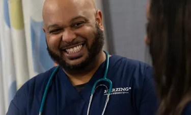 Male Paramedic to BSN Student Smiling in Nashville Nursing Simulation Lab