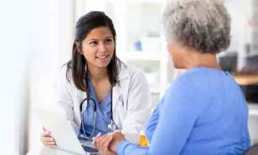 Nursing Student in Scrubs Taking MSN Direct Entry Classes Online