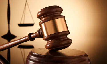 Gavel with Scales in Background
