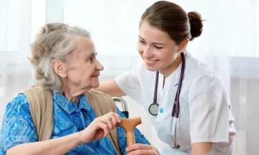 Medical Assistant Helping Patient