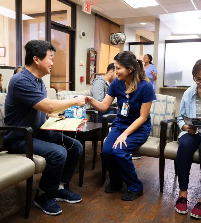 Public Health Nurse with MSN Working with Healthcare Team