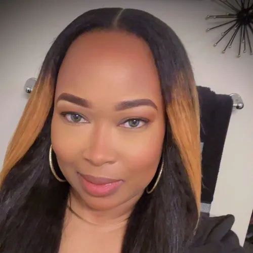 African American woman posing for a selfie in professional attire