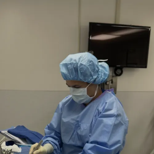 Graduate in complete sterile processing gear in a clinical setting