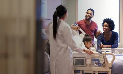 Herzing Nursing Programs MSN Prepared Nurse Practitioner Discussing Diagnosis with Family