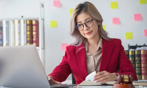 Paralegal Working on Laptop at Home