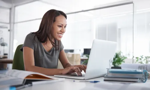 Online Student with Laptop Taking Classes at Home