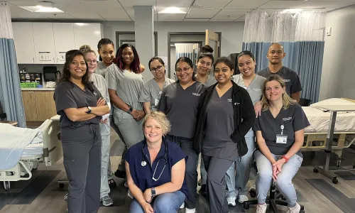 Group of online Herzing students gathered for in-person laboratory simulation