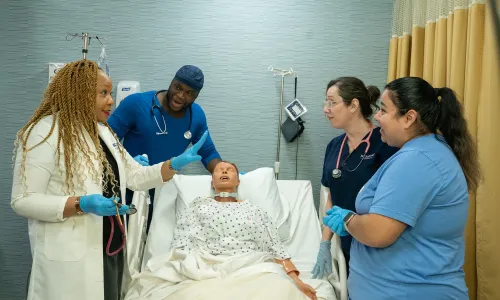 Online Respiratory Therapist to RN Online Students in Scrubs Smiling