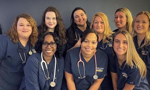 Online Respiratory Therapist to RN Online Students in Scrubs Smiling 