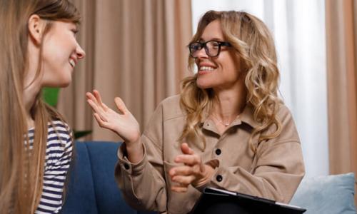 Health and Human Service Worker Smiling with Young Client