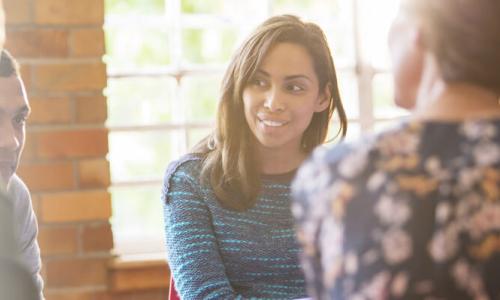 Social Worker in Community Center Meeting