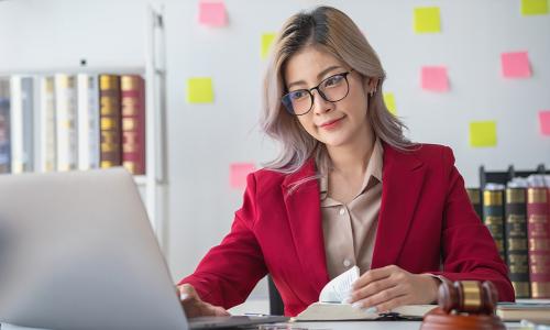 Paralegal Working on Laptop at Home 