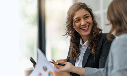 Project Manager Smiling During Meeting 