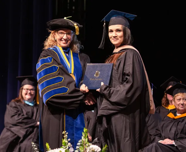 Renee Herzing with nursing student at graduation