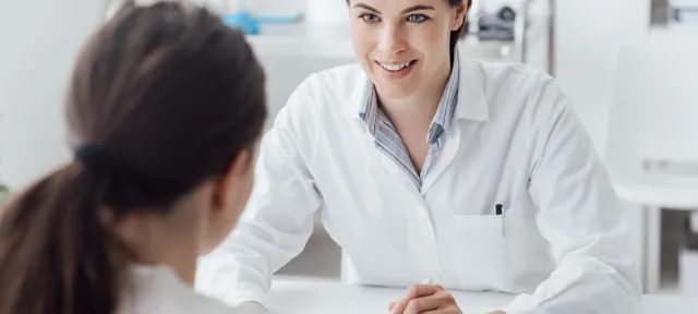 Nurse Practitioner with DNP Speaking with Patient