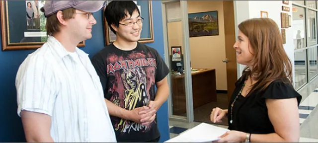 Students speaking with instructor