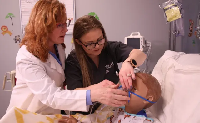 LPN to RN Student in Simulation Lab with Nursing Instructor
