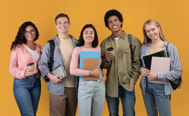 Five college students holding notebooks and folders