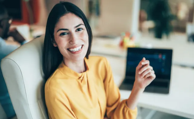 Professional stock trader monitoring stock prices and financial data in a modern trading office environment. Represents investment strategy and market performance.