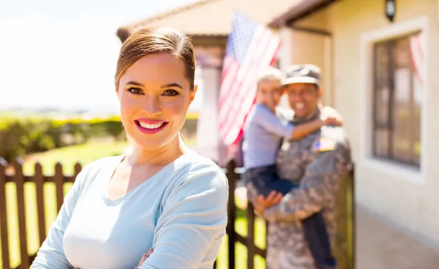attractive young woman in front of her military family