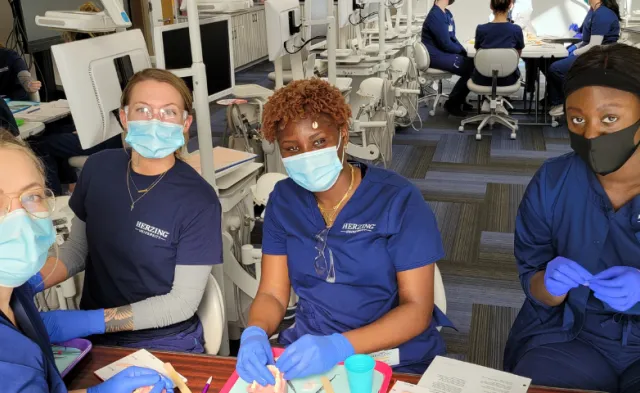 Herzing Surgical technology students in lab