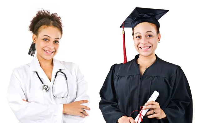 A nursing student smiles while holding her degree in her hand after graduating.