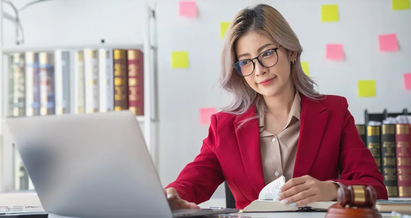 Legal studies associate degree graduate working from home as paralegal