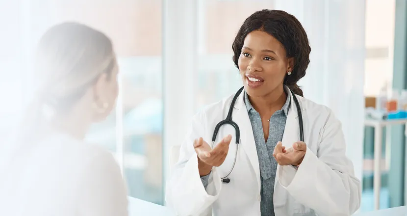 Women's health nurse practitioner discussing treatment options with patient