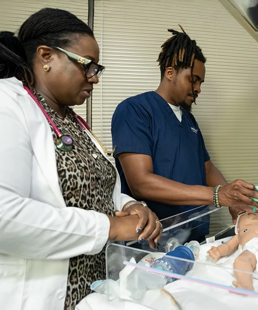 Atlanta nursing students at Herzing University practice newborn care in the skills lab.